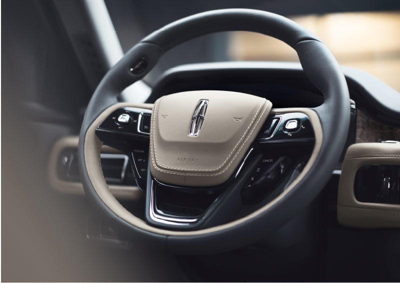 The intuitively placed controls of the steering wheel on a 2023 Lincoln Aviator® SUV | Purchase Lincoln in Mayfield KY