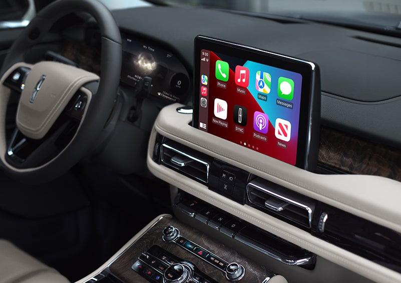 The SYNC® AppLink® screen is shown in the center screen of a 2023 Lincoln Aviator® Grand Touring Plug-in Hybrid model.