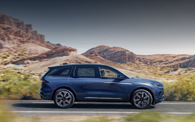 A 2024 Lincoln Nautilus® SUV is being driven in a desert setting. | Purchase Lincoln in Mayfield KY